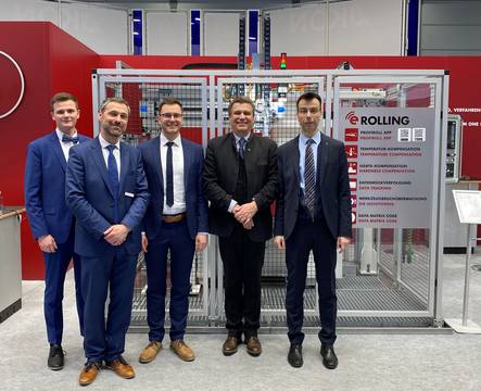 Profiroll show team at INTEC 2023 in Leipzig in front of the automated PR 15 HP